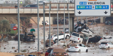 Damaged cars are seen along a road affected by torrential rains that caused flooding, on the outskirts of Valencia, Spain, October 31. REUTERS/Eva Manez Purchase Licensing Rights