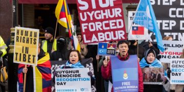 Hongkongers, Tibetans, Uyghur Muslims and their supporters march through central London against the Chinese Communist Party on World Human Rights Day in London, United Kingdom on December 10, 2022.