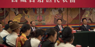 On the same day that Canada announced sanctions against Wu Yingjie (the man with a red tie), former secretary of the Tibet Autonomous Region Party Committee, he was expelled from the party and removed from office for serious violations of discipline and law.

PHOTO: THE ASSOCIATED PRESS/NG HAN GUAN