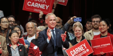 Canada's Prime Minister and Liberal Party leader Mark Carney applauds at a victory party in Ottawa, Ontario on April 29, 2025.
