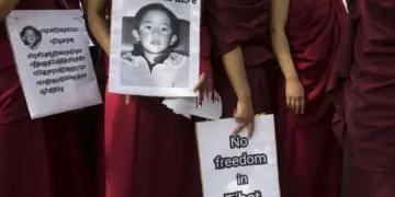 Exile Tibetan Buddhist nuns carry placards during a protest march demanding the release of their religious leader Gedhun Choekyi Nyima, the 11th Panchen Lama, who was put under house arrest by the Chinese authorities this day in 1995 in Tibet, in Dharmsala, India, Wednesday, May 17, 2017. © 2017 AP Photo/Ashwini Bhatia