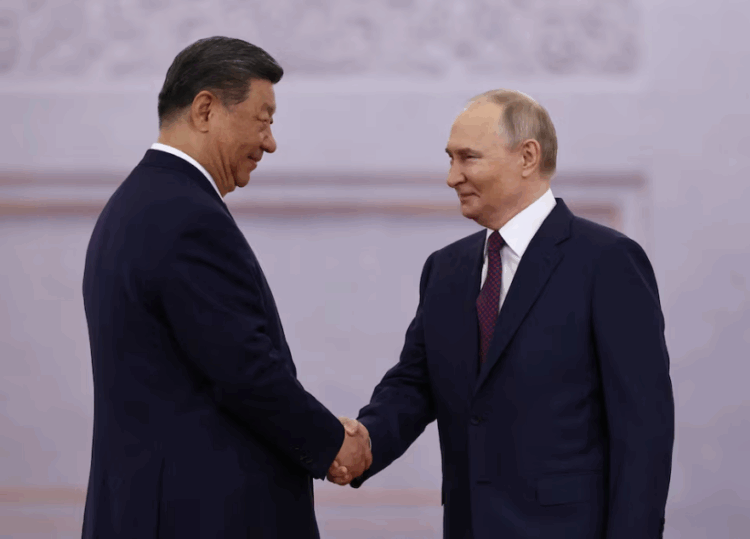 Russian President Vladimir Putin shakes hands with his Chinese counterpart Xi Jinping during a welcoming ceremony before their talks at the Kremlin in Moscow, Russia, May 8, 2025. REUTERS/Evgenia Novozhenina