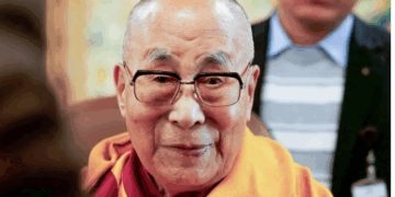 The Dalai Lama offers blessings to his followers at his Himalayan residence in the northern hill town of Dharamshala, India, on December 20, 2024 [Priyanshu Singh/Reuters]