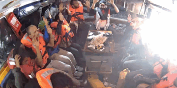 Crew members of the "Madleen" are seen with their hands in the air as Israeli forces come aboard, in this image from the Freedom Flotilla Coalition. Freedom Flotilla Coalition/Freedom Flotilla Coalition/Teleg 