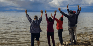 In this handout image released by the Chinese Embassy on June 26, 2025, the first batch of Indian pilgrims at the Manasarovar Lake, in Tibet.