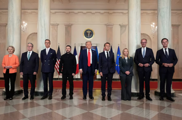 European Commission President Ursula von der Leyen, from left, British Prime Minister Keir Starmer, Finland's President Alexander Stubb, Ukrainian President Volodymyr Zelenskyy, President Donald Trump, France's President Emmanuel Macron, Italy's Prime Minister Giorgia Meloni, Germany's Chancellor Friedrich Merz and NATO Secretary General Mark Rutte pose for a group photo in the Grand Foyer of the White House on Monday. ALEX BRANDON/THE ASSOCIATED PRESS