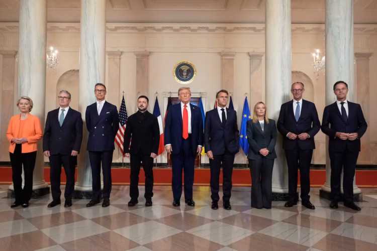 European Commission President Ursula von der Leyen, from left, British Prime Minister Keir Starmer, Finland's President Alexander Stubb, Ukrainian President Volodymyr Zelenskyy, President Donald Trump, France's President Emmanuel Macron, Italy's Prime Minister Giorgia Meloni, Germany's Chancellor Friedrich Merz and NATO Secretary General Mark Rutte pose for a group photo in the Grand Foyer of the White House on Monday. ALEX BRANDON/THE ASSOCIATED PRESS
