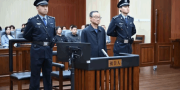 China's former agriculture minister Tang Renjian (centre) received a suspended death sentence for bribery at a court in Jilin province on Sunday, Sep 28, 2025. (Photo: Changchun Intermediate People's Court)