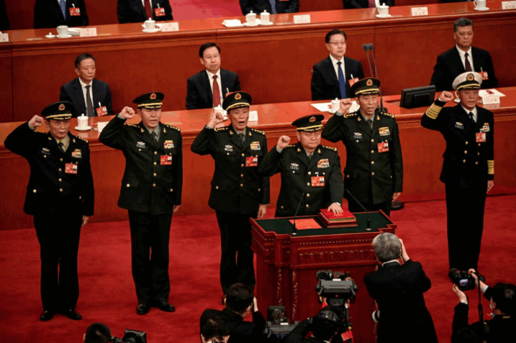 Zhang Youxia (front), newly-elected Vice Chairman of the Central Military Commission of the People's Republic of China, swears an oath with members of the Central Military Commission (L-R) Zhang Shengmin, Liu Zhenli, He Weidong, Li Shangfu, and Miao Hua, after they were elected during the fourth plenary session of the National People's Congress (NPC) at the Great Hall of the People in Beijing. photo credit: Reuter