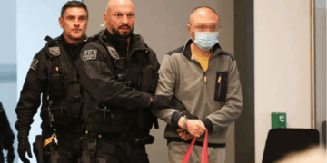 Jian Guo (R) had denied spying for China during his trial