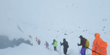 [1/4] A screen capture from video shows trekkers leaving their campsite, as unusually heavy snow and rainfall pummeled the Himalayas, in the Tibet Region, China, October 5, 2025. Geshuang Chen/Handout via REUTERS Purchase Licensing Rights