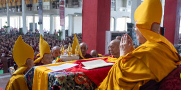 Gaden Tripa Lobsang Dorje presenting traditional offerings to His Holiness the Dalai Lama during Ganden Ngamchö Celebrations at Drepung Monastery in Mundgod, Karnataka, India on December 14, 2025. Photo by Ven Zamling Norbu