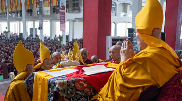 Gaden Tripa Lobsang Dorje presenting traditional offerings to His Holiness the Dalai Lama during Ganden Ngamchö Celebrations at Drepung Monastery in Mundgod, Karnataka, India on December 14, 2025. Photo by Ven Zamling Norbu