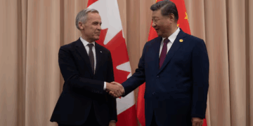 Prime Minister Mark Carney shakes hands with Chinese President Xi Jinping at the start of a meeting in Gyeongju on Oct. 31, 2025.