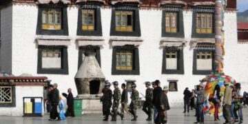 Tibet, China - Sep 7, 2012. Chinese soldiers walking at the Jokhang temple in Lhasa, Tibet. The Jokhang Temple has two Buddha statues sacred to Tibetan Buddhists. — Photo by phuongphoto
