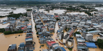 Torrents of muddy water swiftly engulfed homes in Nanning city in southern China