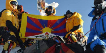 On May 21, climbers seen on top of Mt Everest with Tibetan flag and photo of Dalai Lama. Photo: Kalachakra by His Holiness the Dalai Lama/Facebook