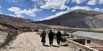 Changpa nomads walk on a rugged path in Ladakh's Chushul valley [Tarushi Aswani/Al Jazeera]